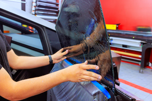 Sunlight shining through a tinted window onto a protected car interior, illustrating how window tinting prevents UV damage and fading.
